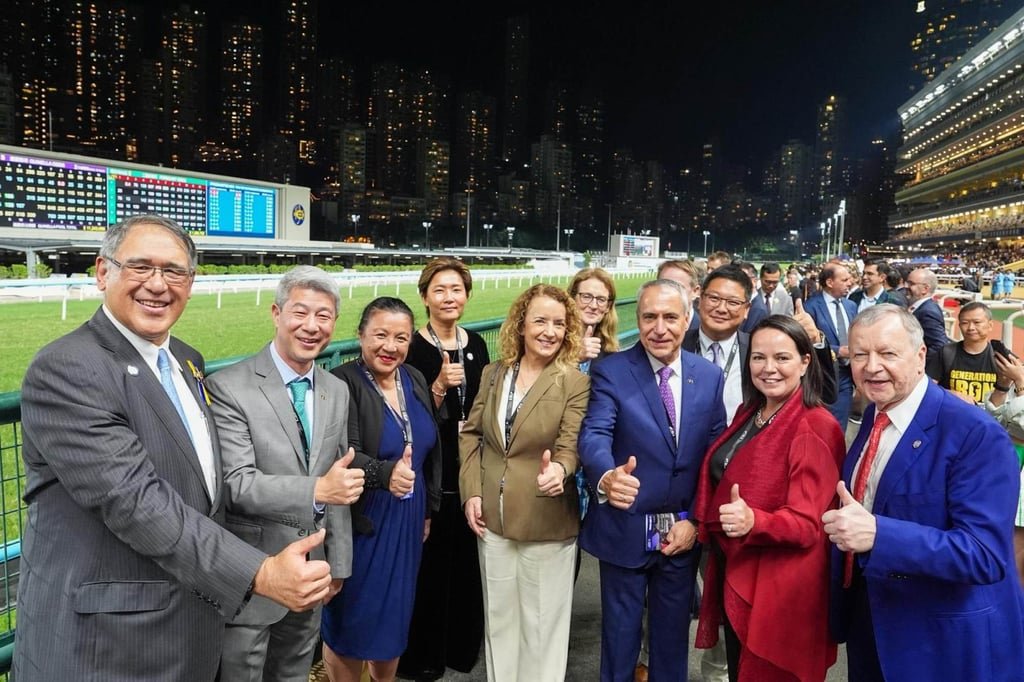 Hong Kong Jockey Club officials and delegates from the FEI enjoy a night of racing at Happy Valley. Photo: HKJC