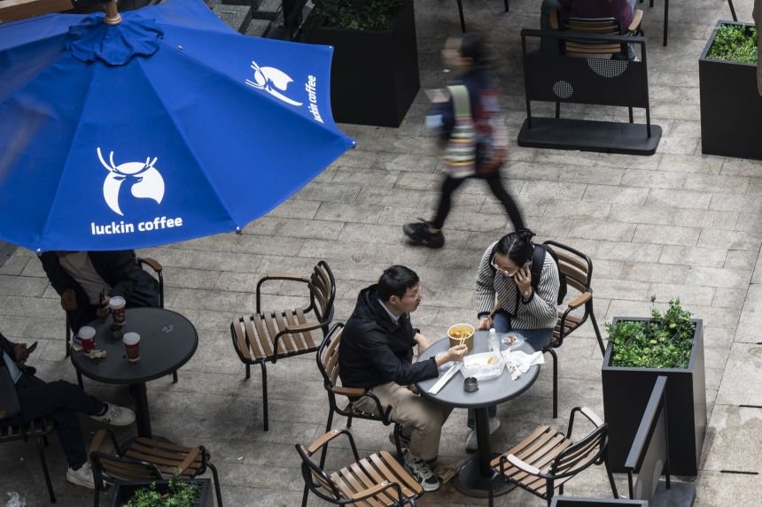 Customers at a Luckin Coffee Inc. store in Shanghai on November 22, 2024.